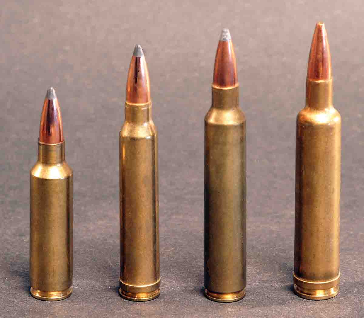 Thirty-caliber cartridges have often been crowded into bolt-action magazines, one reason some .30-caliber spitzers have relatively blunt ogives. They don’t have to be seated as deeply, allowing more room for powder. This results in a little more muzzle velocity but reduces downrange velocity. Cartridges include (left to right): the .300 Winchester Short Magnum, .300 Winchester Magnum, .300 Remington Ultra Mag and the .30-378 Weatherby Magnum.